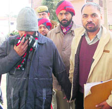 The accused in police custody. 