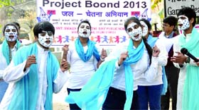 Schoolchildren perform a street play to spread awareness of the importance of saving water in New Delhi on Saturday.