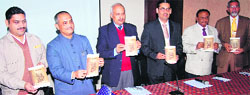 Captains of the industry release a catalogue of the Industrial Expo in Haridwar on Saturday.