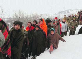 People being evacuated from Waltengoo Nard hamlet in Kulgam district