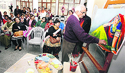 An artist uses strokes of his brush to paint a canvas during an art workshop held at BD Arya Girls College in Jalandhar on Saturday