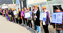 Students from DAV institutes form a human chain as they hold an awareness rally on water conservation in Jalandhar on Saturday