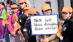 Students from DAV institutes form a human chain as they hold an awareness rally on water conservation in Jalandhar on Saturday