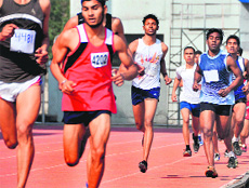 Athletes take part in a 1,500m race during the 58th Punjab State Schools Athletics Meet at Guru Nanak Stadium, Ludhiana, on Saturday.