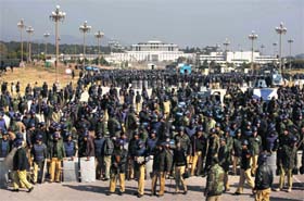 UNEASY TIMES: Riot police outside Parliament during the protest by Qadris supporters in Islamabad