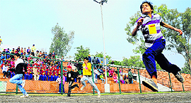 Children participate in the 100-metre race during the Kids Olympics at the Sports Complex, Sector 7, in Chandigarh on Sunday