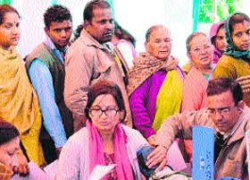 A doctor examines a patient at a health camp organised by Shri Mahant Indresh Hospital in Dehradun on Sunday.