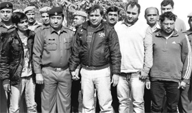 Four criminals in police custody at Gurgaon. Gang leader Varinder Nehra, alias Fauji, carries a reward of Rs 1 lakh on his head. The gang has confessed to at least four murders. 