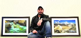 Manraj Singh with his works during a photo exhibition in Ludhiana.