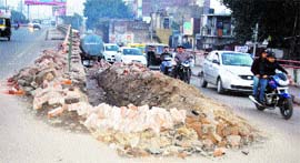A road being widened on Jagraon Bridge.