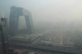 The China Central Television building in Beijing engulfed in heavy haze