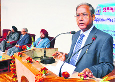 SEBI chief addresses a seminar at Guru Nanak Dev University in Amritsar on Monday.