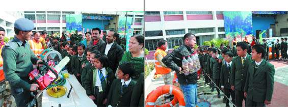 National Disaster Response Force (NDRF) personnel explain the utility of an equipment (left) and a survival technique (right) to the students of St. Xaviers School in Bathinda on Monday. 