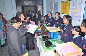 Judges grade the projects and models on display at the Science Fest organised at the RBDAV Senior Secondary School in Bathinda on Monday. 