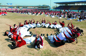 Students rehearse for the Republic Day celebrations, at the Multi-purpose Sports Stadium in Bathinda on Monday. 