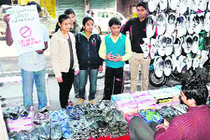 A group of young students urge traders to shun plastic material due to its ill-effects on the environment in Haridwar.