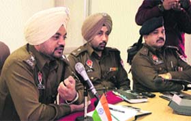 Police officials chair a meeting of bankmen in the wake of the recent bank lockers burglary, in Jalandhar on Monday