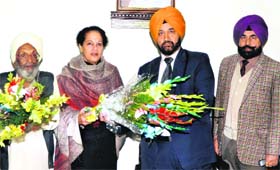 Dr Gurpinder Singh Samra (orange turban) being felicitated on joining as the principal of Lyallpur Khalsa College in Jalandhar