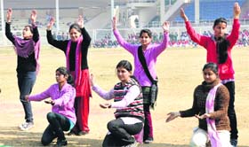 College students rehearse for the Republic Day parade function at Guru Gobind Singh Stadium