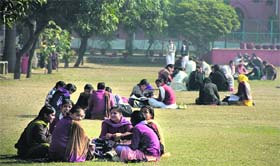 Students enjoy sitting in the sun in a college in Jalandhar on Monday