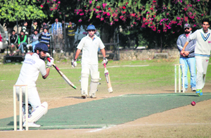 Players in action during the ongoing Inter-Collegiate Cricket Tournament at University of Jammu on Monday.