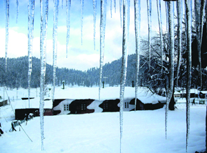 Icicles hang from the roof of a chatel in Gulmarg