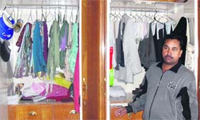 Owner of the house shows the cupboard which was targeted by thieves in Jagraon