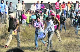Police officials with the body of the girl in Ludhiana on Monday