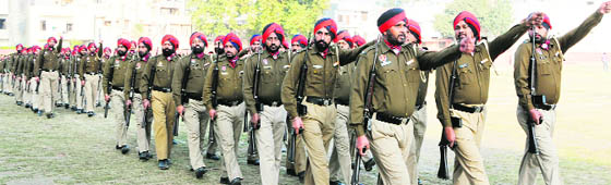 Punjab Police personnel move in sync during a rehearsal for the Republic Day parade, at Guru Nanak Stadium in Amritsar on Monday. 