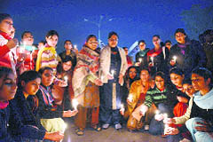 Punjab Mahila Congress president Dr Malti Thapar and her supporters hold a candle march at Moga on Monday in protest against the rising crime against women in the state. 
