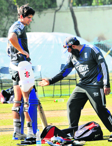 England captain Alastair Cook takes tips from spin coach Mushtaq Ahmed ahead of the fourth ODI in Mohali.