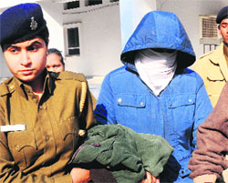 Accused Chinar being taken to the District Courts, Sector 17, Chandigarh, on Tuesday. Tribune Photo: S Chandan