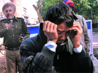 A boy who was caught selling tickets on the black market. tribune photo: Vicky Gharu