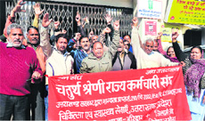 Class IV employees stage a protest in Haridwar on Tuesday.