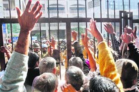 INDL supporters shout slogans outside the Rohini district courts in Delhi on Tuesday.