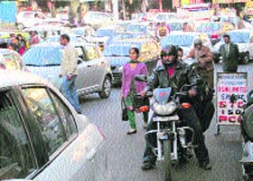 Encroachments on both sides of a highway cause traffic jam in Palampur