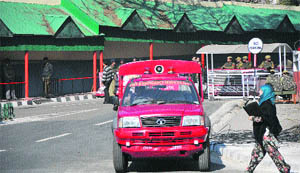 An emergence fire service vehicle comes out of the Civil Secretariat in Jammu on Tuesday. 
