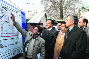 Chief Minister Omar Abdullah along with his cabinet colleagues look at the site plan of Tehzeeb Mahal near the Tourist Reception Centre in Srinagar on Tuesday. 