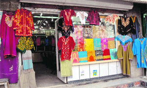 Pherans on sale at a garment store in Srinagar on Tuesday. 