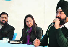 The MC officials during the auction of the SCOs in Ludhiana on Tuesday. 