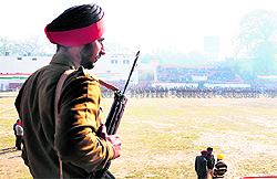 A policeman stands guard in Guru Nanak Stadium where the Chief Minister will unfurl the national flag on Republic Day, in Amritsar on Wednesday