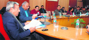 Uttarakhand Chief Secretary Alok Kumar Jain chairs a review meeting of various departments in Dehradun on Wednesday.