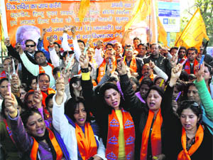 Leaders of the Shiv Sena carry knives to be distributed among girl students at Gandhi Park in Dehradun on Wednesday. 