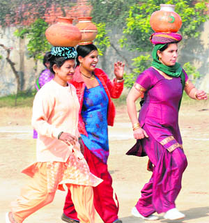 Anganwadi workers participating in a chaati (pot) race during their games in Karnal on Wednesday.