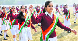 Schoolchildren rehearse for the Republic Day celebrations at Karan Stadium in Karnal on Wednesday. 