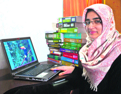 Amara Wani, who topped the Class XII examination, at her home in Srinagar on Wednesday.