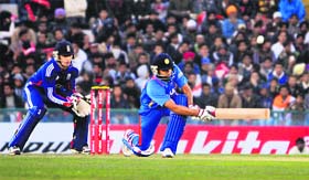 Rohit Sharma sweeps during his innings of 83 in Mohali