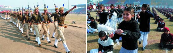 (Left) A police contingent takes part in the march past during the dress rehearsal for the Republic Day function, at the Multi-purpose Sports Stadium on Thursday; school kids in a playful mood while rehearsing for their performance.