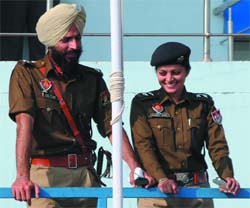 DSP Rajpal Singh shares a point with his wife, DSP Avneet Sidhu, during the dress rehearsal for the R-Day function in Bathinda on Thursday.