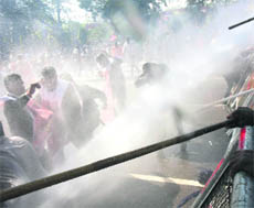 Water canons being used on agitating workers of the BJP in Chandigarh on Thursday. 